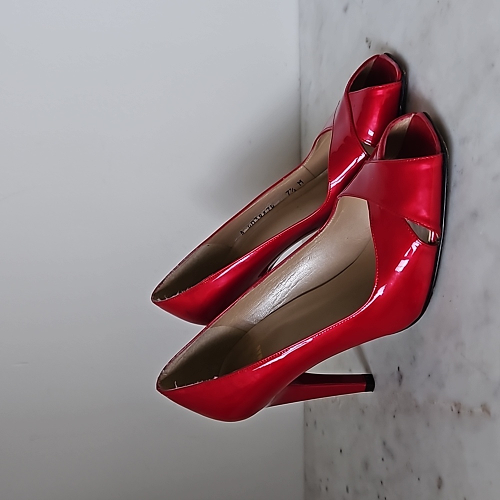 STUART WEITZMAN: glossy ruby red patent leather heels